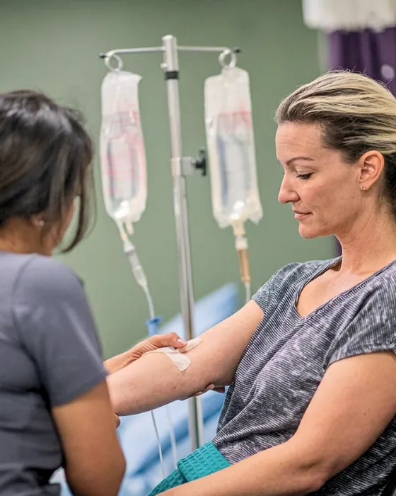 Registered Nurse administering IV therapy